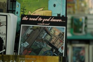 “The Road to God Knows” tracks the life of teenage protagonist Marie as she deals with her mother’s schizophrenia. It is just one of many comic books and graphic novels lining the shelves of Atlantis Fantasyworld, located on Cedar Street. Photo by Kathryn Power.