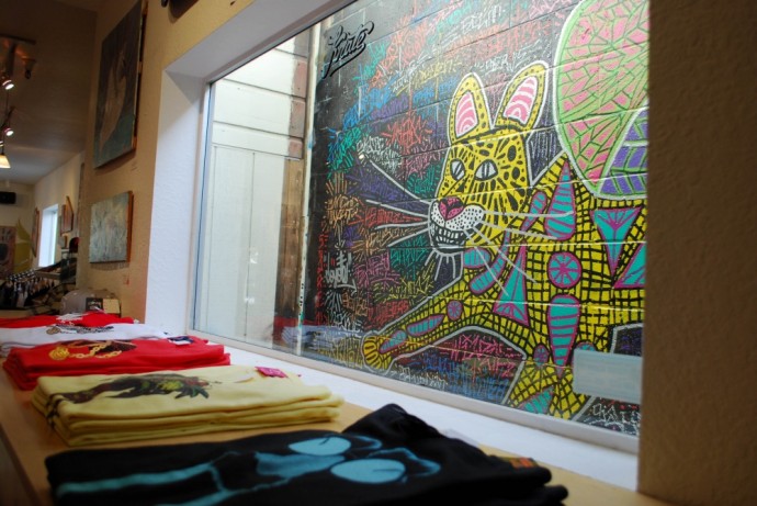 Mike Kershnar's art is displayed on the walls of The Krate, an apparel, vinyl and art supply store located on Pacific Avenue in downtown Santa Cruz. Photo by Rosario Serna.