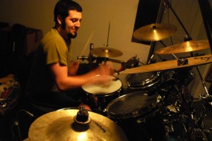 Ian Thornburgh, drummer of Disenglorified, practices their song “Ballz Deep in the Dead.” Photo by Devika Agarwal.