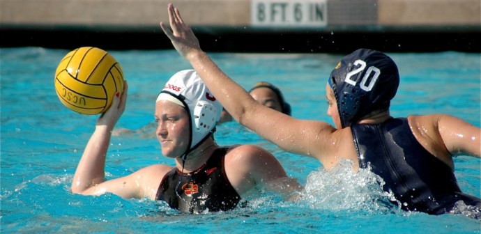 A Santa Cruz player forces her Davis opponent to quickly pass the ball. Photo by Kathryn Power.