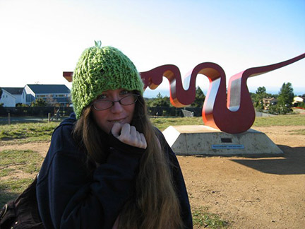 Aaryn Goldberg, wearing her trademark green beanie, in front of the Porter Squiggle. Photo courtesy of Linda Kuck.