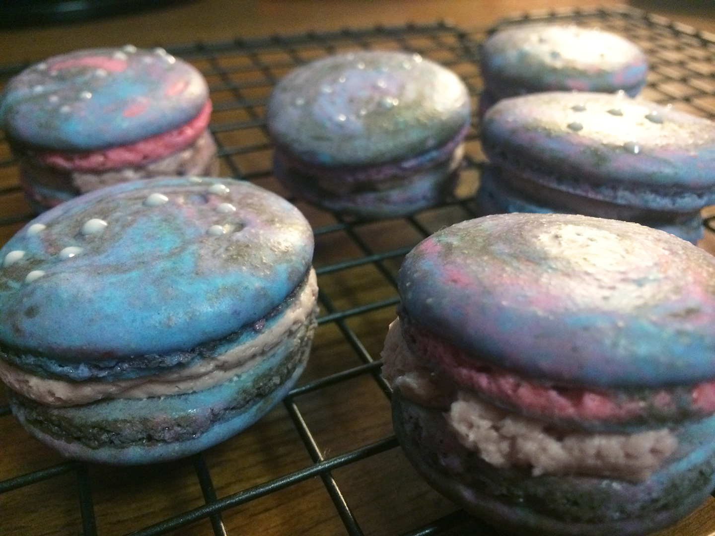 “The main complaints we have are that we don’t get to eat his cookies and cupcakes anymore,” said cross country head coach Jamey Harris of Carmichael’s avid baking. This photo features Constellation French macarons he made to replicate constellations (left to right, top to bottom): Pisces, Virgo, Leo, Scorpius, nothing but space, Orion, and Ursa Major. When asked about how he practices self control when he bakes so often, he said he mostly bakes for others and “basically just tries one cookie to sees how they taste, the rest are to share.” Photo courtesy of Theron Carmichael