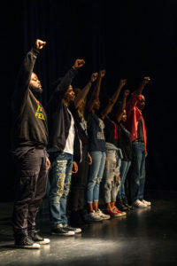 The actors of the Minority Report raise their fist in solidarity with the African American community and the social injustices and discrimination that they face throughout the country. The play sheds light on several lesser known issues that have a very big impact on the African American community. Photo by Alonso Hernandez